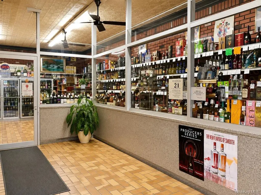 Interior sales counter and shelving inside the liquor store