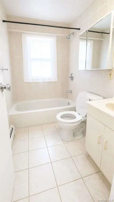 Second full bathroom with vanity and window