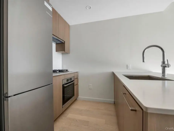 Modern open kitchen in the Longfield one-bedroom condominium