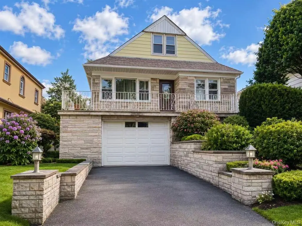 Whitestone four-bedroom single-family home — front exterior with driveway